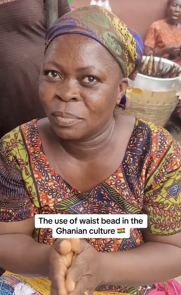 Market woman tells a short cultural story on waistbeads 