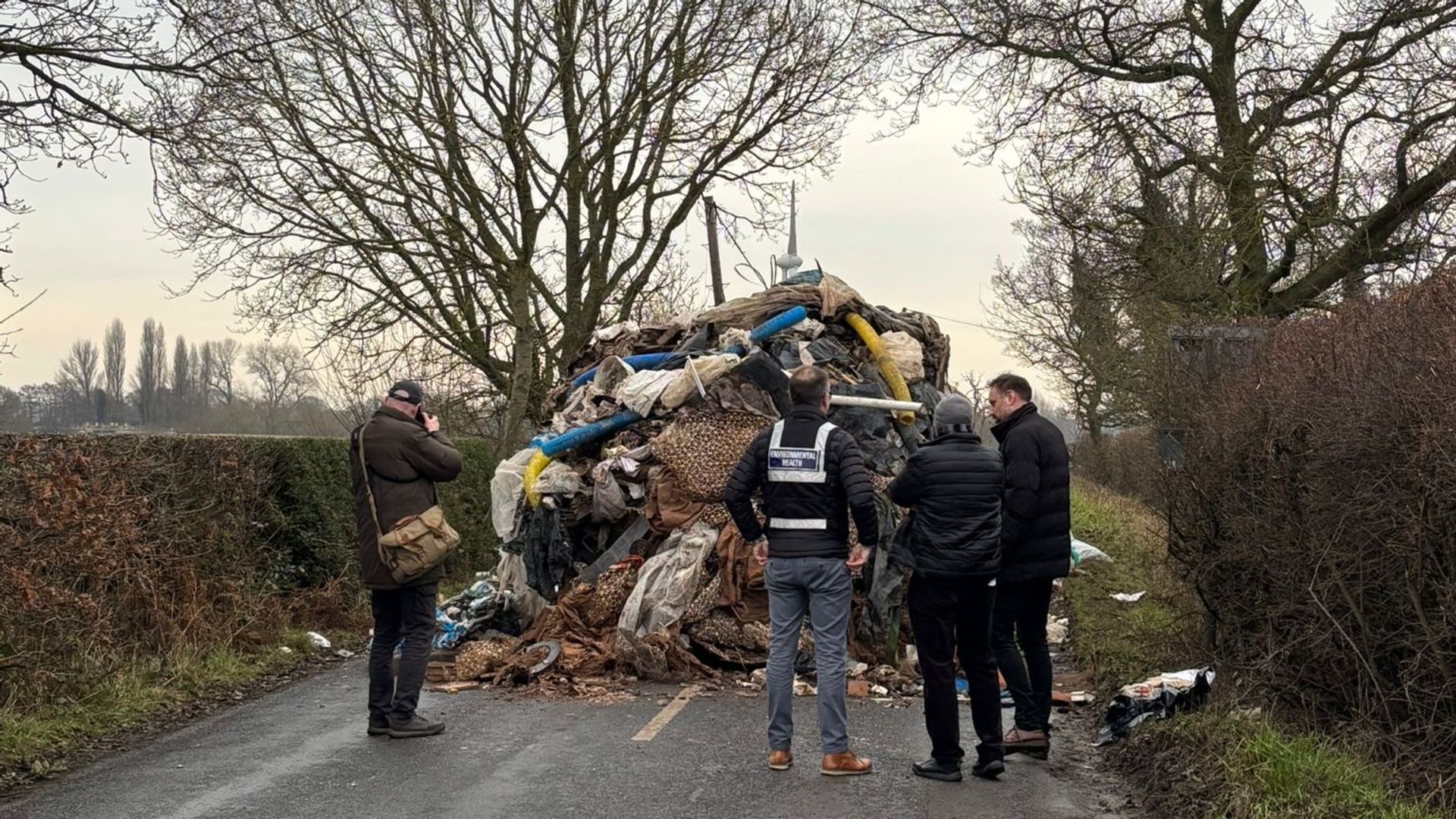 Residents 'shocked' as village is blocked in by 80ft-long mound of dumped rubbish