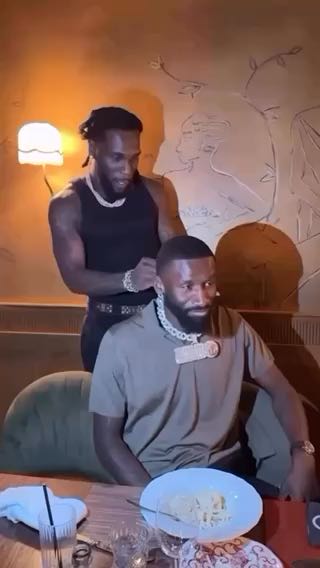 Antonio Rüdiger rocking Burna Boy's Gambo chain