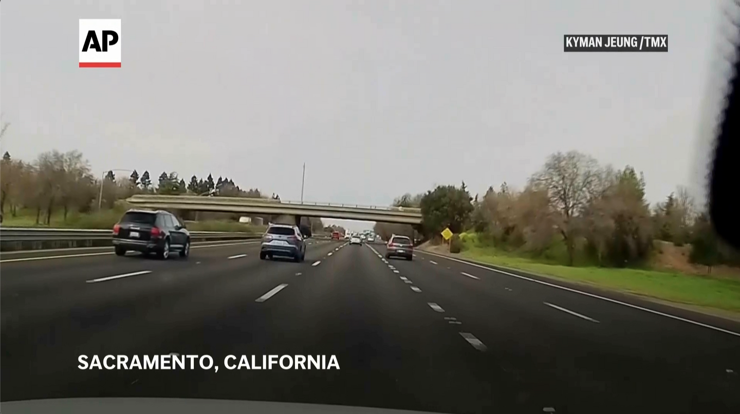 WATCH: Car flies off overpass into highway traffic