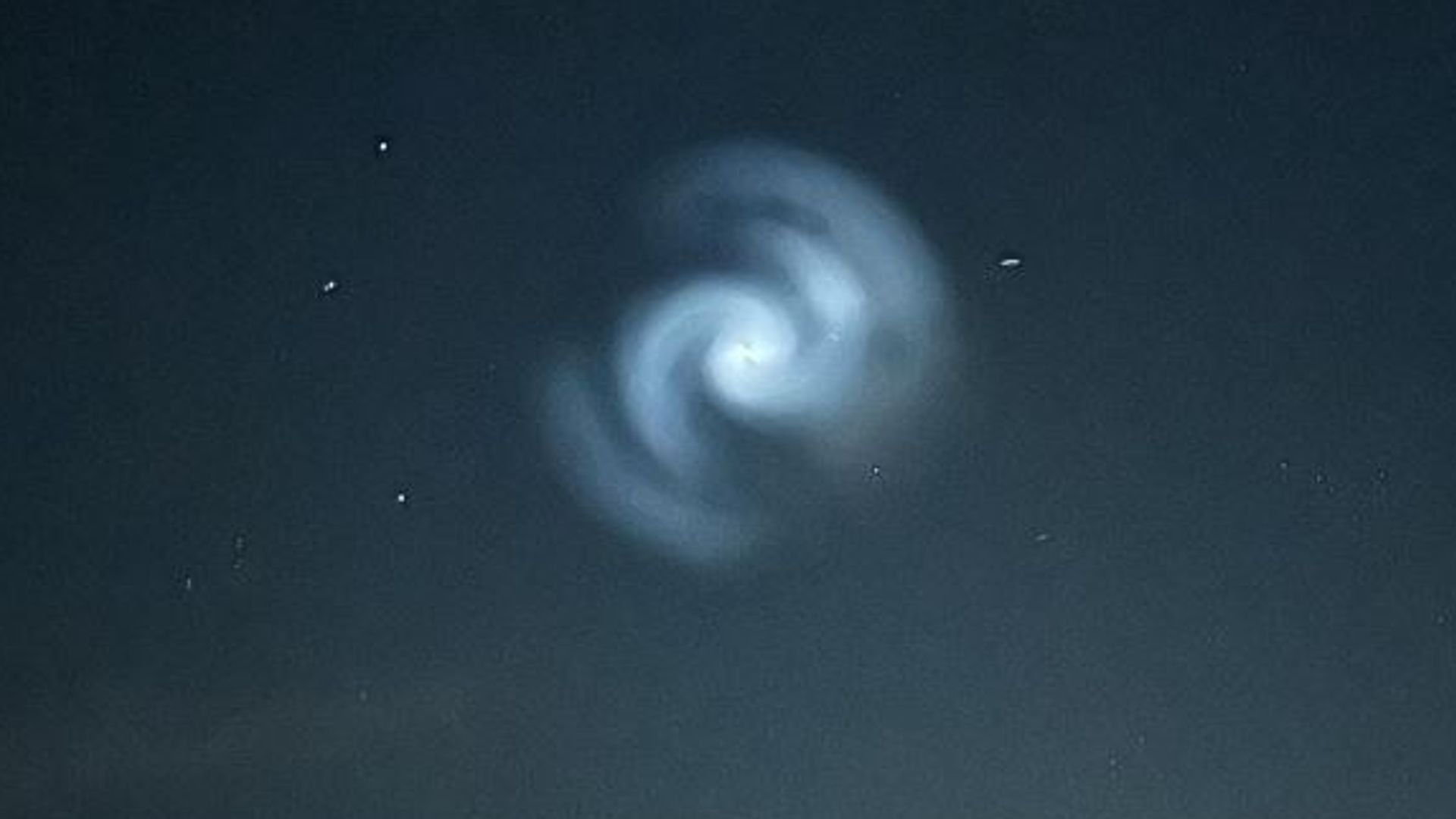 Glowing spiral appears in night sky