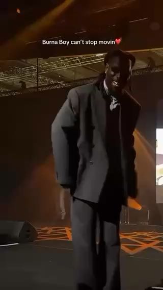  Burna Boy dropping moves while performing 