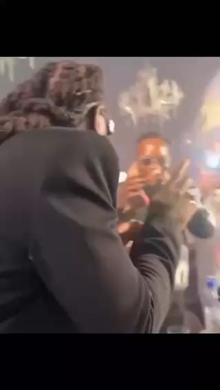  Naira Marley greeting Burna Boy during his