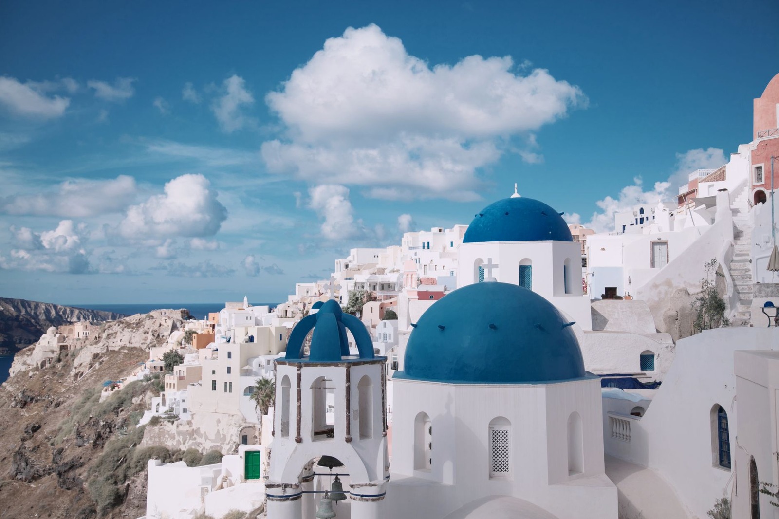Santorini does not look real until you are standing in it.